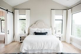 Blue accent wall, cozy farmhouse master bedroom with natural wood accents. 75 Beautiful Large Farmhouse Bedroom Pictures Ideas July 2021 Houzz