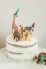 Liam S First Birthday Party Animals Lilies And Loafers Animal Birthday Cakes First Birthday Cakes Animal Cake Topper