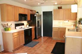 Another way to give your kitchen a makeover is to have your cabinets refinished. Update Builder Grade Cabinets Fast Without Painting