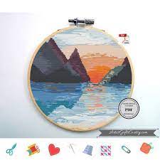 It is a black and white symbol pattern. Nature Cross Stitch Pattern Pdf Sunset Sun Mountain Etsy In 2021 Cross Stitch Cross Stitch Patterns Nature Cross Stitch