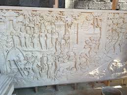 Balinese artisan sarwaedi sculpts the wall panel from suar wood, expertly highlighting the wood's natural grain.includes. Stone Relief Wall Art Bali Carving
