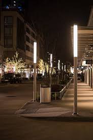 River Oaks District Is An Outdoor Shopping Complex Of Luxury Brands Restaurants And Sidewalk Cafes Sleek Streetscape Design Park Lighting Street Light Design