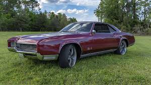 Image result for Riviera Red 1966 GM