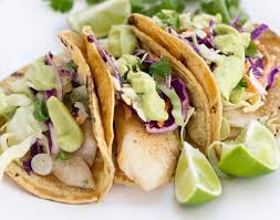 Marinated flank steak, grilled, sliced and stuffed into soft golden corn tortillas. Tex Mex Fish Tacos With Guacamole Gameonfood Com