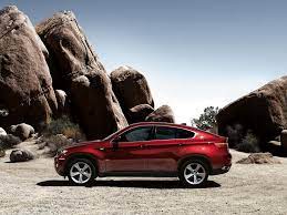 Bmw X6 This Car Epitomizes The Goal Of The So Called Crossover An Suv With Car Character This Side View Of The Gnarly X6 Bmw X6 Car Wallpapers Bmw Cars