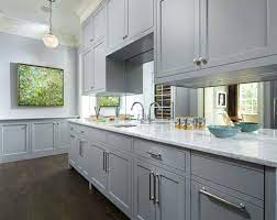 Modern light grey kitchen cabinets with white countertops. The Psychology Of Why Gray Kitchen Cabinets Are So Popular Luxury Home Remodeling Sebring Design Build