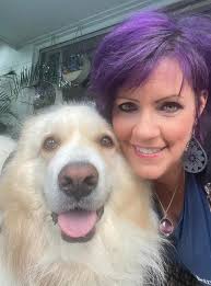 Hi! My friends call me Suz. Here I am with one of my Great Pyrenees, Athena  🐶