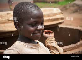 Poor rural african child smiling in cameroon Stock Photo