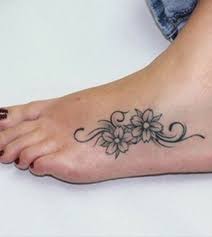 Small and many lily flower tattoo design on arm and shoulder. 72 Best Flower Tattoos On Foot