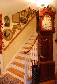 It can be tricky to know how to place the gallery wall, but there are a ton of different options for how you configure it and you almost can't go wrong. Decorating Staircase Walls With Vintage Photos And Mirrors Between Naps On The Porch