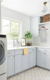 Many small laundry room ideas maximize limited space to fit appliances and supplies. Light Blue Laundry Room Paint Colors Design Ideas