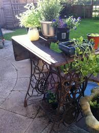 My New Garden Ornament A Vintage Singer Sewing Table Singer Sewing Tables Diy Garden Decor Sewing Table
