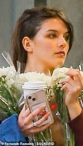 Suri Cruise is spitting image of Dawson's Creek star mom Katie Holmes as  she picks up flowers in NYC