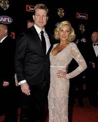 Wiki, wife, marriage, career, net worth, and bio! Collingwood Coach Nathan Buckley With Wife Tania Red Carpet Fashion Red