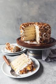 An Image Of A Slice Of Burnt Almond Cake Filled With Almond Pastry Cream Then Frosted With Almond Flavored Swiss Meringue Desserts Almond Cakes Almond Pastry