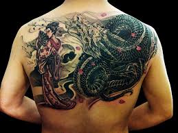 A deformed skull drawn fully over the back. Chronic Ink Tattoos Toronto Tattoo Shop Geisha And Dragon Half Back Tattoo Asian Tattoos Body Art Tattoos Tattoos