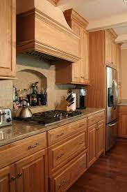 Cabinets are set off with sleek stainless steel handles. Natural Oak Cabinet Houzz