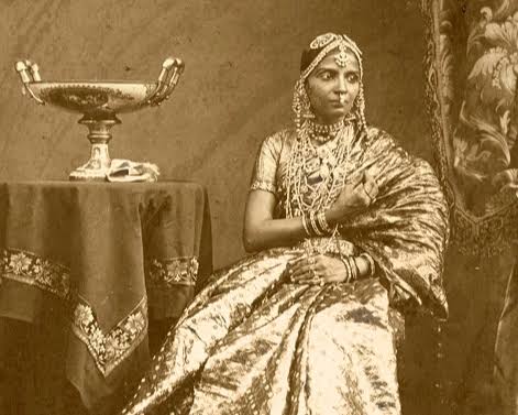A series of rare photographs of women adorning traditional Dravidian jewelry from the Archaeological Survey of India Collections. Picture 1 - Gentoo dancing girls from Madras, displaying jewelry, shot by Nicholas &