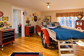 An upholstered bed, metal nightstand, and simple blue linen shade with blue trim create a masculine yet approachable atmosphere. From Boys To Men The Best Male Bedroom Designs