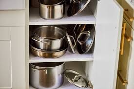 The 8 Trick To Miraculously Making Space For Your Pot Lids Where You Thought There Wasn T Any Pot Lids Pot Lid Organization Pot Organization