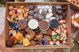 A capi mineral water and a salad pot featuring seasonal ingredients and proteins, served in an individual recyclable box ask our sales staff for the salad variety featured on the day. Grazing Boxes