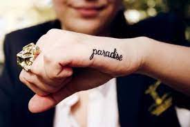 35 Spectacular One Word Tattoo Designs You Will Love To Get Inked One Word Tattoos Hand Tattoos Tattoos For Women Small