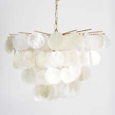 The flower glows from within when the light is illuminated. Large Capiz Teen Chandelier Pottery Barn Teen
