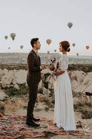 Unique Elopement Alert This Couple Exchanged Vows Among Over 100 Hot Air Balloons In Cappadocia Turkey Junebug Weddings Wedding Expert Junebug Weddings Winter Wedding Destinations