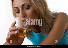 woman drinking brandy Stock Photo