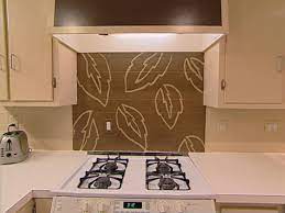Ceramic tile or possibly stone in a expected pattern. Handpaint A Kitchen Backsplash Hgtv