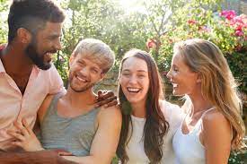 Male And Female Gay Friends At Home Having Party In Garden Together -  Mental Health Partners
