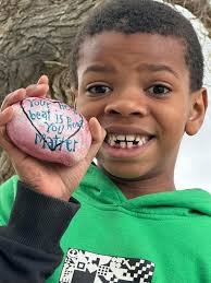 Proud of rock painters who brighten strangers' days