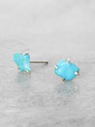 Beautiful chrysoprase gemstone on white background. Raw Turquoise Nugget Posts Lunessa