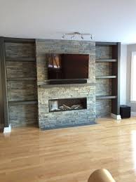 Watch how ustone adhesive makes quick work of. Television Above Valor Gas Fireplace With Stone Cladding Surround Modern Family Room Ottawa By The Fireplace Center And Patio Shop Houzz