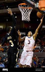 Auburn Tigers guard Chris Denson (3) goes up for a layup as Arkansas-Pine  Bluff's Davon Haynes (3) attempts to block him during the NCAA basketball  game at the Auburn Arena