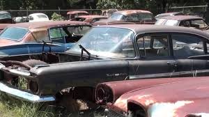 You can't miss it because there are several huge old lollipop gasoline signs out front. Gearhead Field Of Dreams Antique Car Salvage Yard Youtube