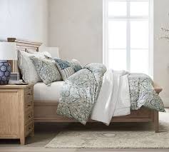 You can also create a cozy nest by using a king size duvet to add extra warmth or create a draped effect where your duvet cover trails far beyond the edge of the bed. Blue Mackenna Paisley Percale Patterned Duvet Cover Sham Pottery Barn