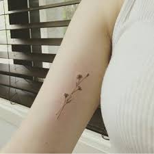 05 Tiny Wildflower Arm Tattoo Styleoholic Wildflower Tattoo Flower Tattoo Arm Tattoos