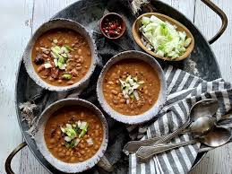 Pinto beans and ham is an easy, economical way to make a big pot full of tasty, filling, pinto beans and leftover ham, flavored with onion and garlic! Smokey Ham Hock Pinto Beans Pinto Beans Pinto Bean Recipe