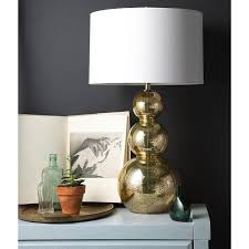 This glass gourd table lamp boasts an unmistakable gold mercury finish atop a brushed nickel base. Glamorous Gold Glass Table Lamp