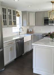 Before after of kitchen update painted cabinets darker hardwood. We Love This Stylish Gray Kitchen With Goldhardware Kitchen Remodel Small Kitchen Renovation Kitchen Layout