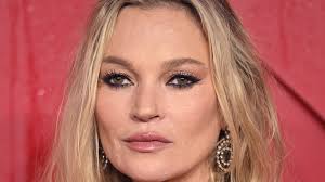 Kate Moss proudly totes her 65p Aldi reusable bag after SHOCKING shoppers  by visiting Manchester branch of bargain grocery store before glitzy Chanel  show... but all is not as it seems |