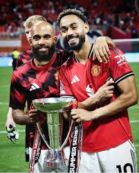  Cunha and Mbeumo posing with the      !  Manchester United new signings played 45  minutes in tonight's game together, the Red Devils got the trophy. How many