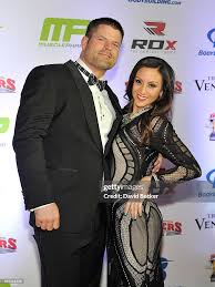 Host Brian Stann and his wife Teresa Stann arrive at the seventh... News  Photo