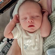 THREE WEEKS OLD • How?! Thinking of how big he is already getting is just  wild to me… newborn clothes are already so snug!! We're moving right along  into 0-3 months!