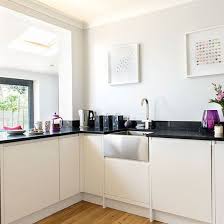 The exuberant styling sets this sink apart from its peers, catching the eyes of any visitor that graces your kitchen. Modern Kitchen With Belfast Sink Novocom Top