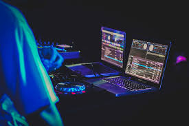 You may be wondering if your personal computer a laptop or a notebook? Hd Wallpaper Two Laptop Computers And Dj Turntables Two Laptop Computers Turned On And Displaying Music Editor Wallpaper Flare