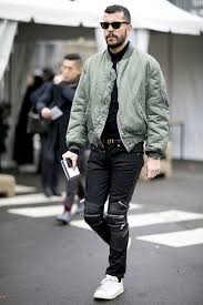 Men S Olive Bomber Jacket Black Turtleneck Black Jeans White Leather Low Top Sneakers Mens Bomber Jacket Outfit Mens Outfits Mens Casual Outfits