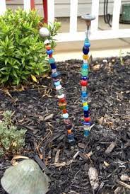 I'm kristi from the speckled dog and it's my pleasure to be guest posting over here today sharing some easy diy beaded garden stakes. Beaded Garden Stakes