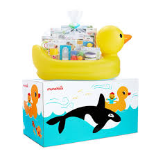 Cute little boy taking a bath on a white background. White Hot Duck Tub Gift Basket Munchkin